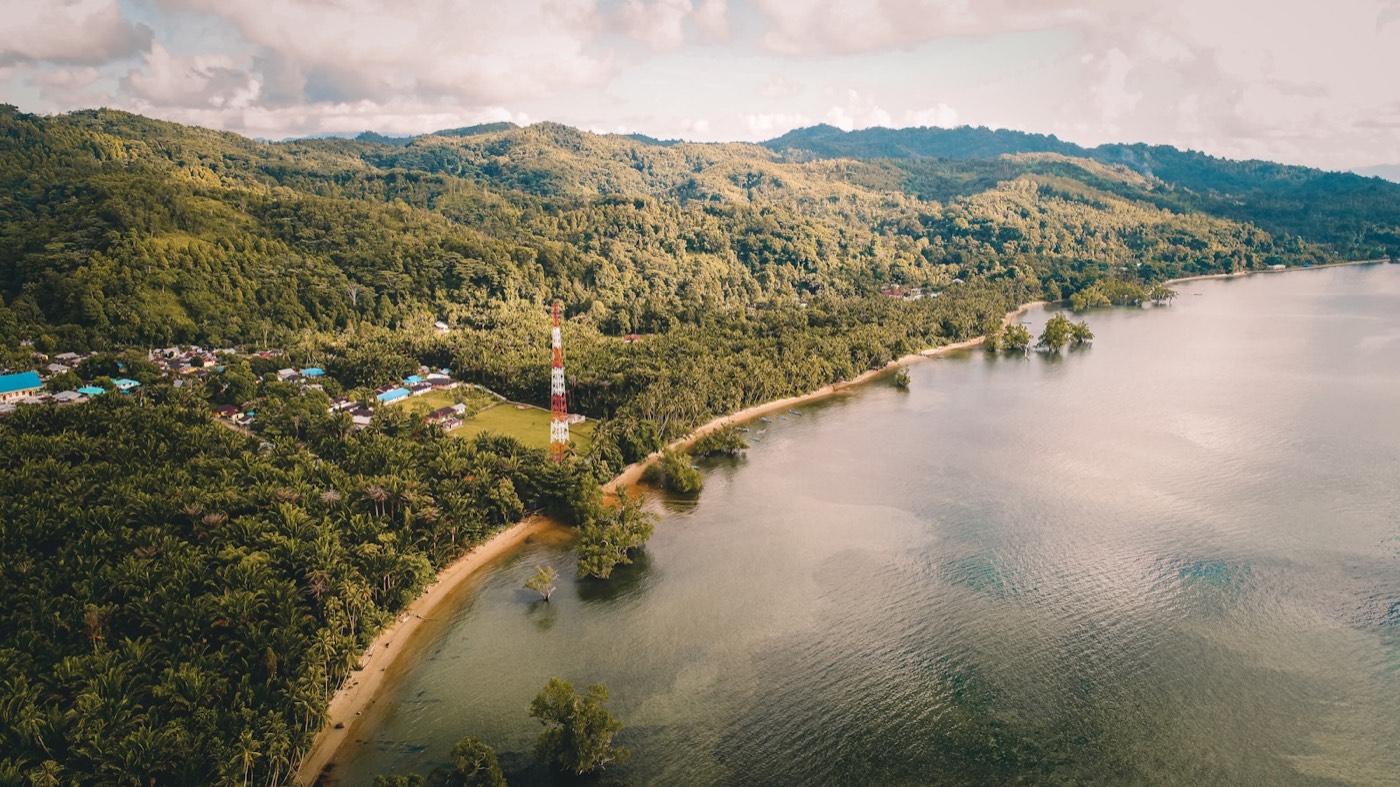 Aerial view of Ambon's coastline, village and beach